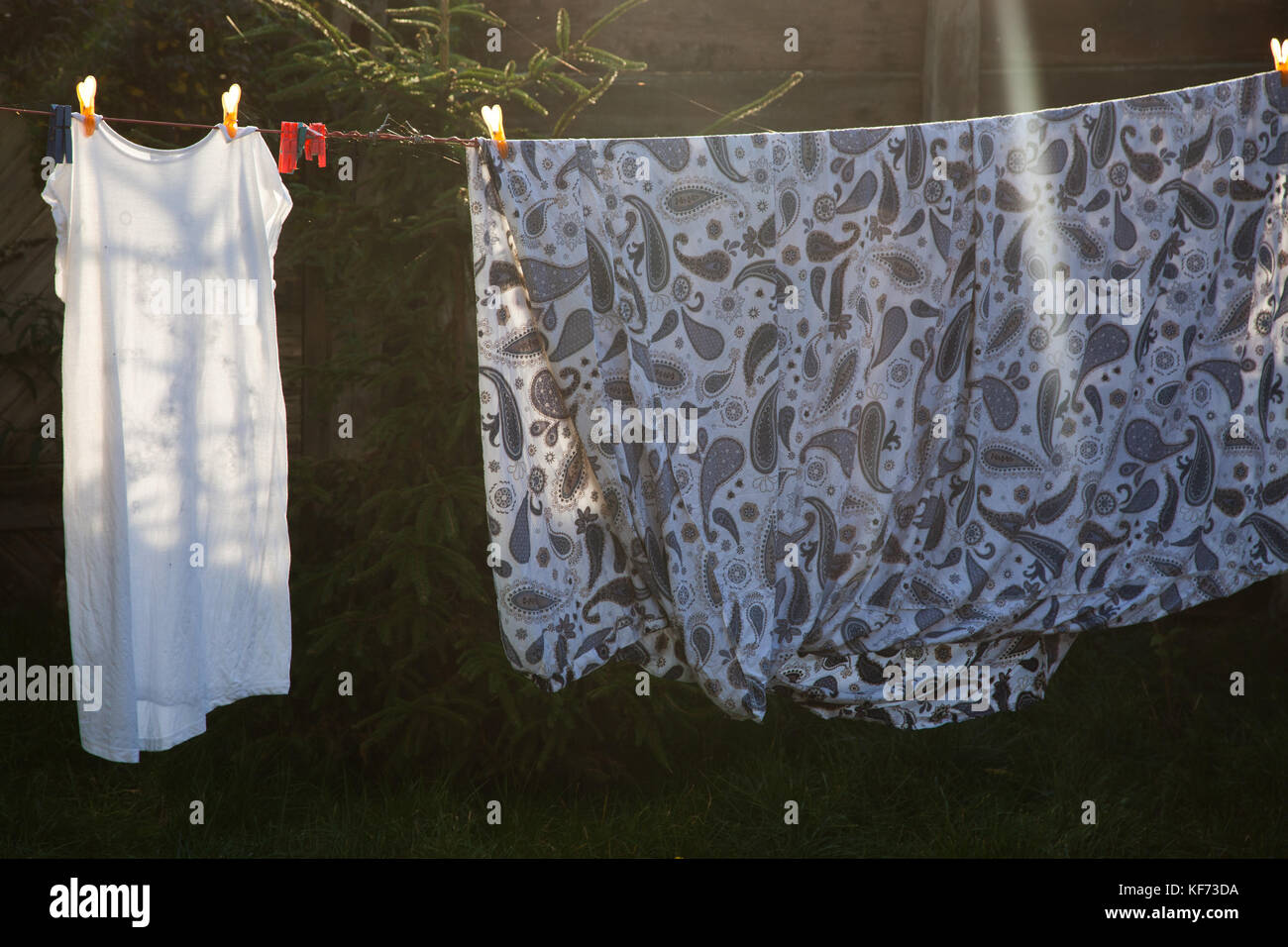 cotton bed sheets and linen, hang out on a laundry line outside in the