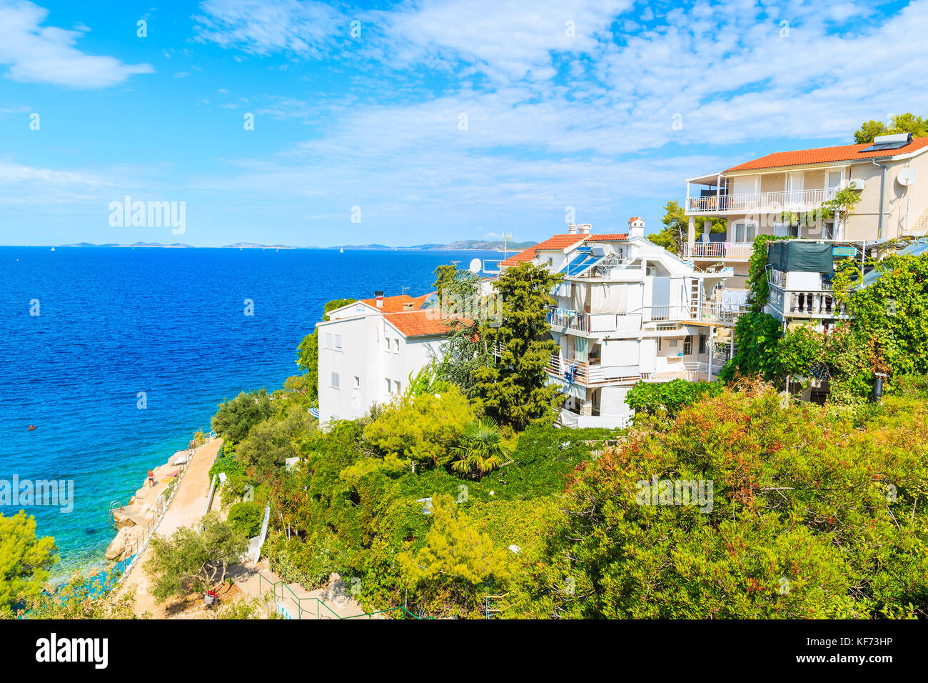 Holiday houses with apartments on sea coast near Primosten town, Dalmatia, Croatia Stock Photo