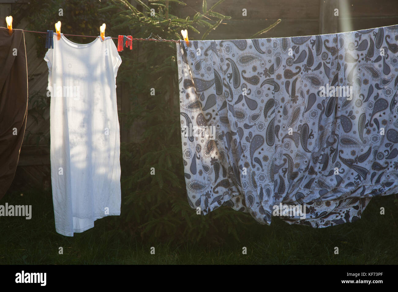 cotton bed sheets and linen, hang out on a laundry line outside in the