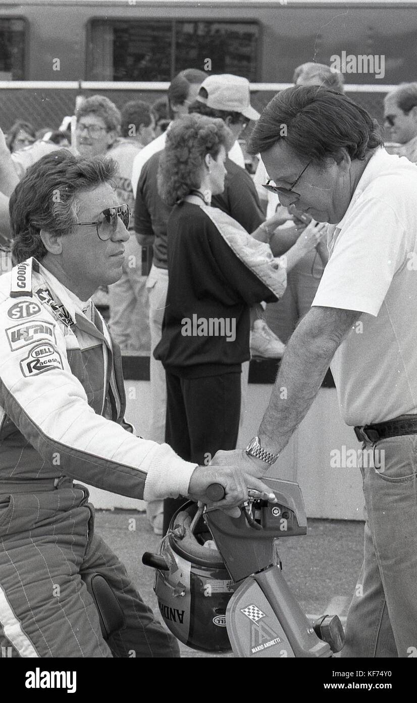 Mario Andretti and Carl Haas conferring before race. Stock Photo