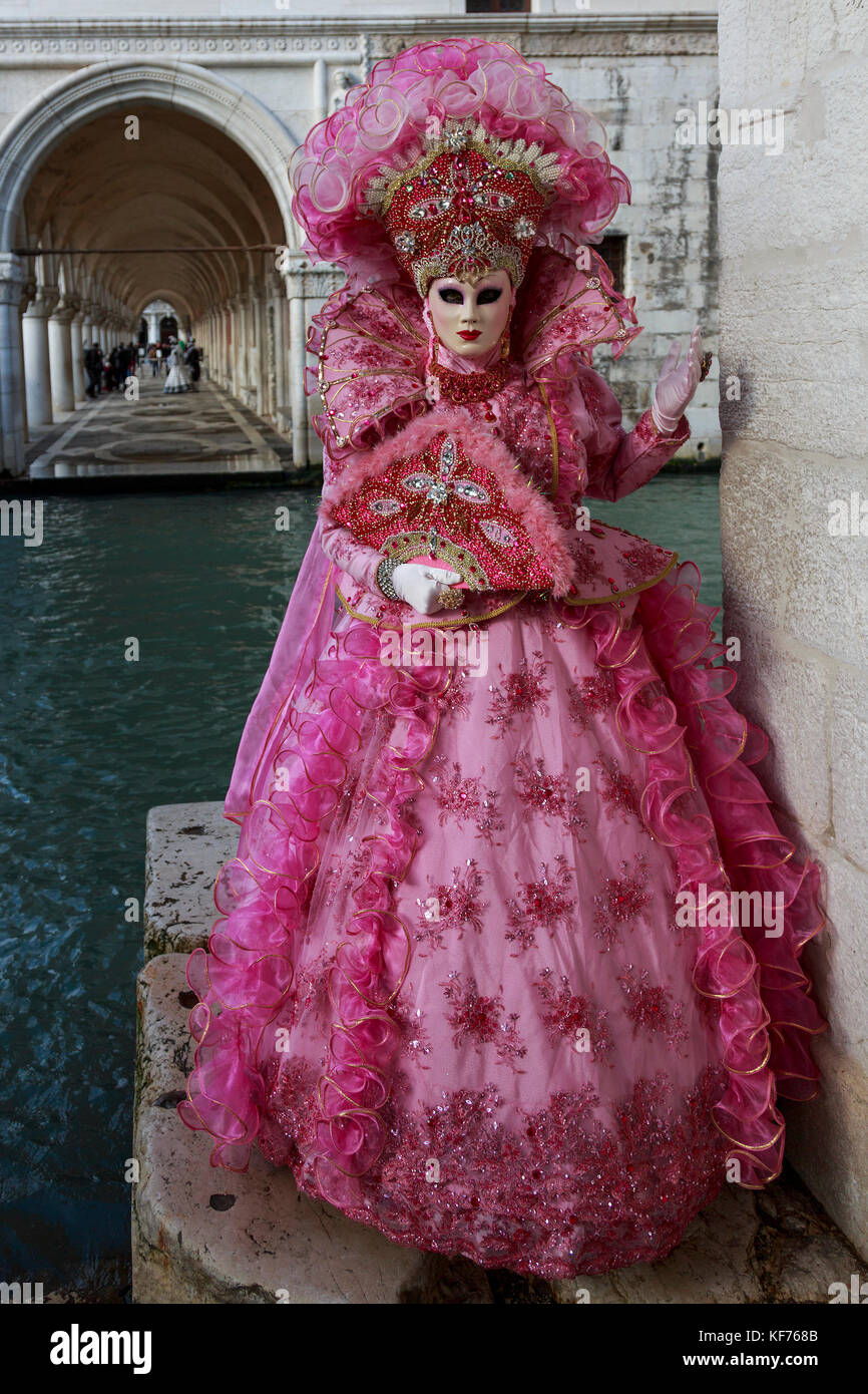 Person in costume wearing a mask at the carnival in Venice,