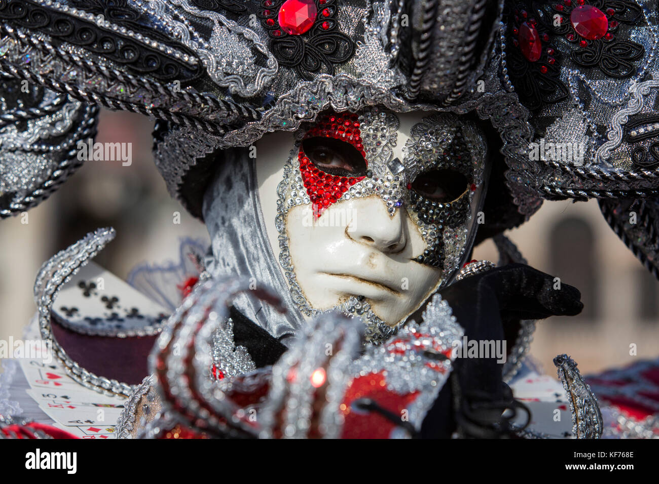 Person in costume wearing a mask at the carnival in Venice,