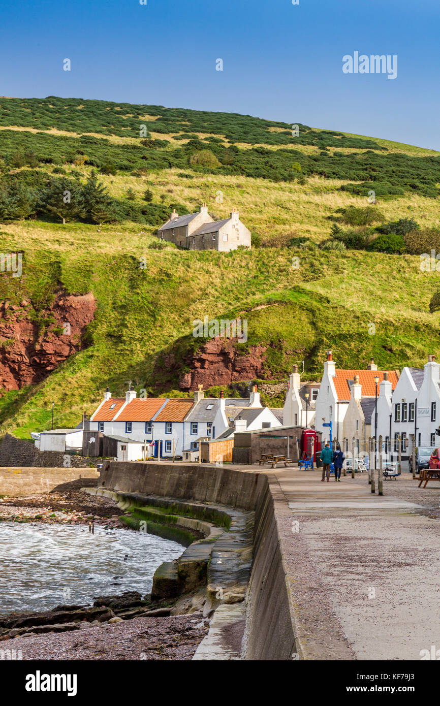 Looking east along the row of seafront cottages in the small Scottish fishing village of Pennan, Aberdeenshire, Scotland, UK Stock Photo