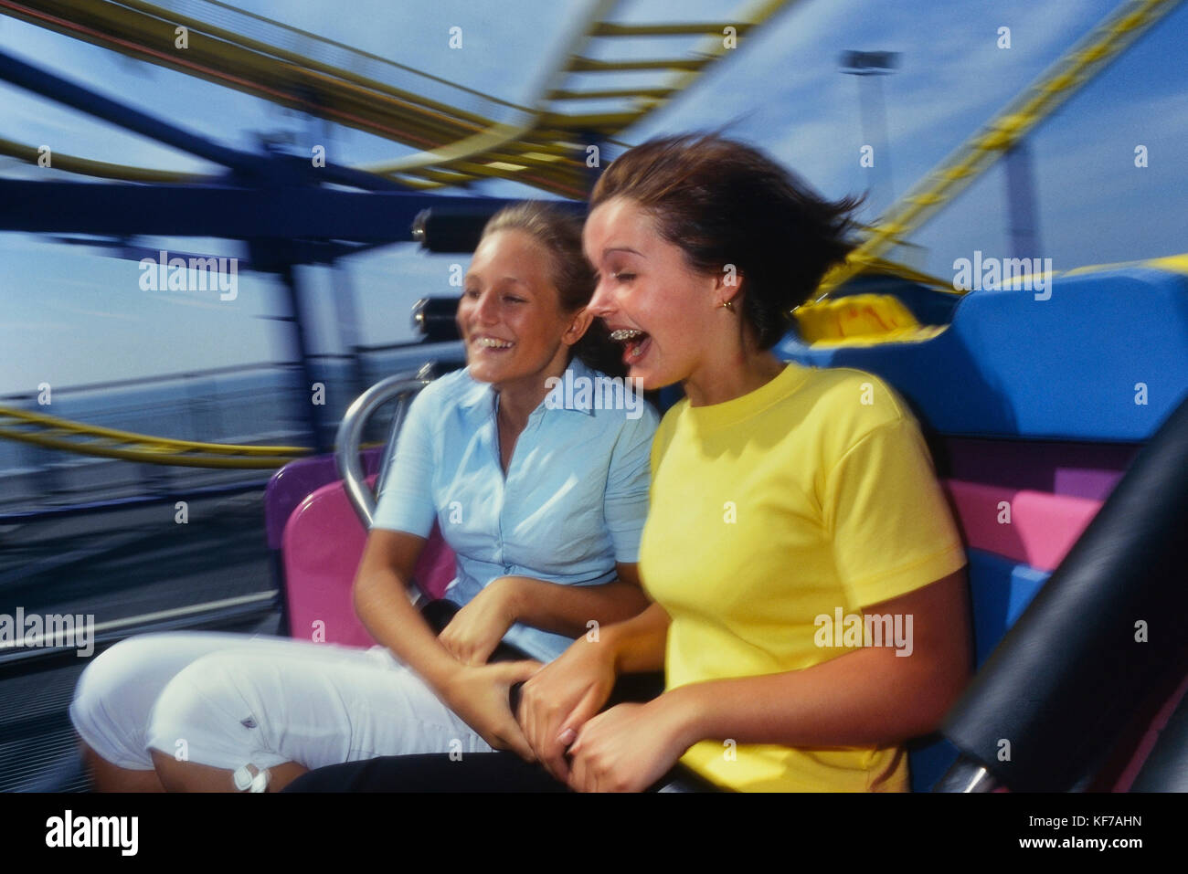Teenage girls on a roller coaster, Blackpool, Lancashire, England, UK