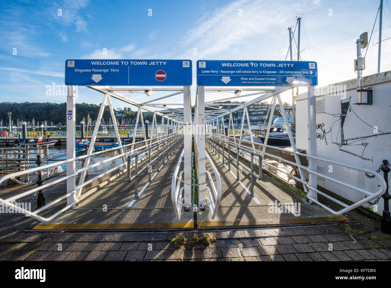 Empty ferry and pleasure boat terminal with entry and exit signs on the River Dart in Dartmouth, Devon, England, UK Stock Photo