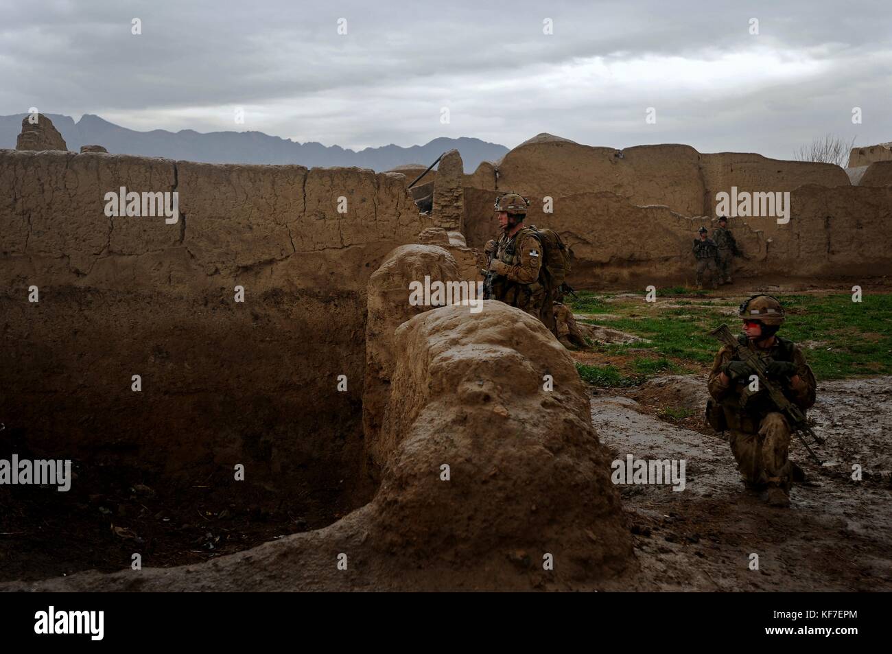 U.S. and Canadian soldiers patrol an Afghan village from a lookout during Operation Enduring Freedom February 5, 2010 in Terot Kulacha, Afghanistan.    (photo by Kenny Holston via Planetpix) Stock Photo
