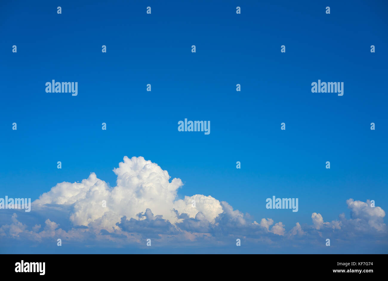 Blue sky white cumulus clouds background Stock Photo - Alamy