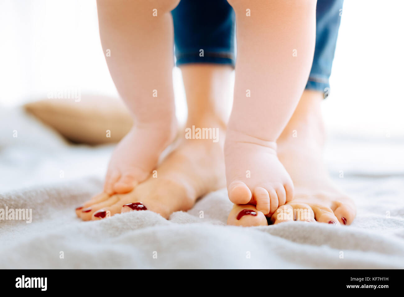 Cute little child attempting to take steps Stock Photo