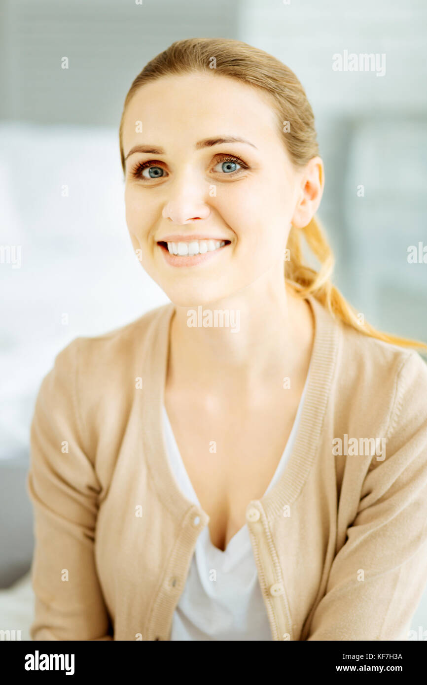 Nice young woman looking extremely happy Stock Photo