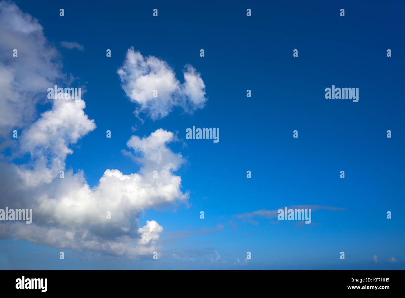 Blue summer sky white cumulus clouds background Stock Photo - Alamy