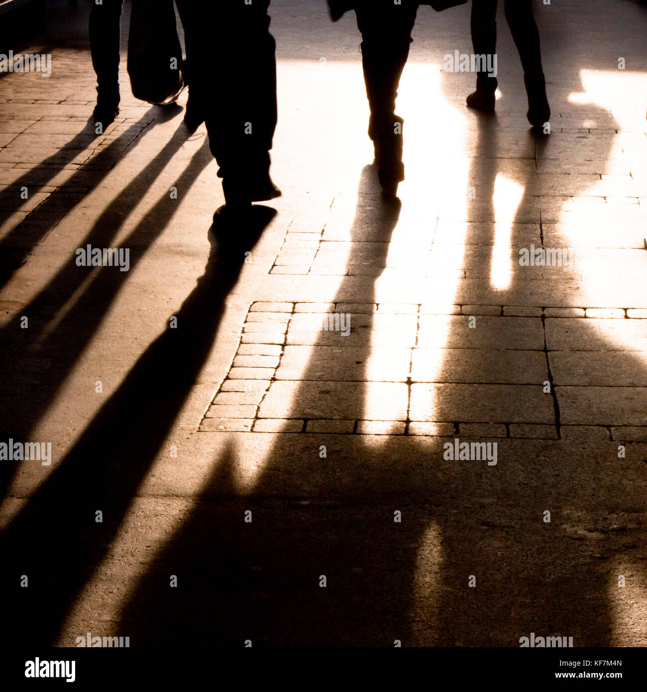 Blurry shadow and silhouette of people walking on the city street  sidewalk , in black and white Stock Photo