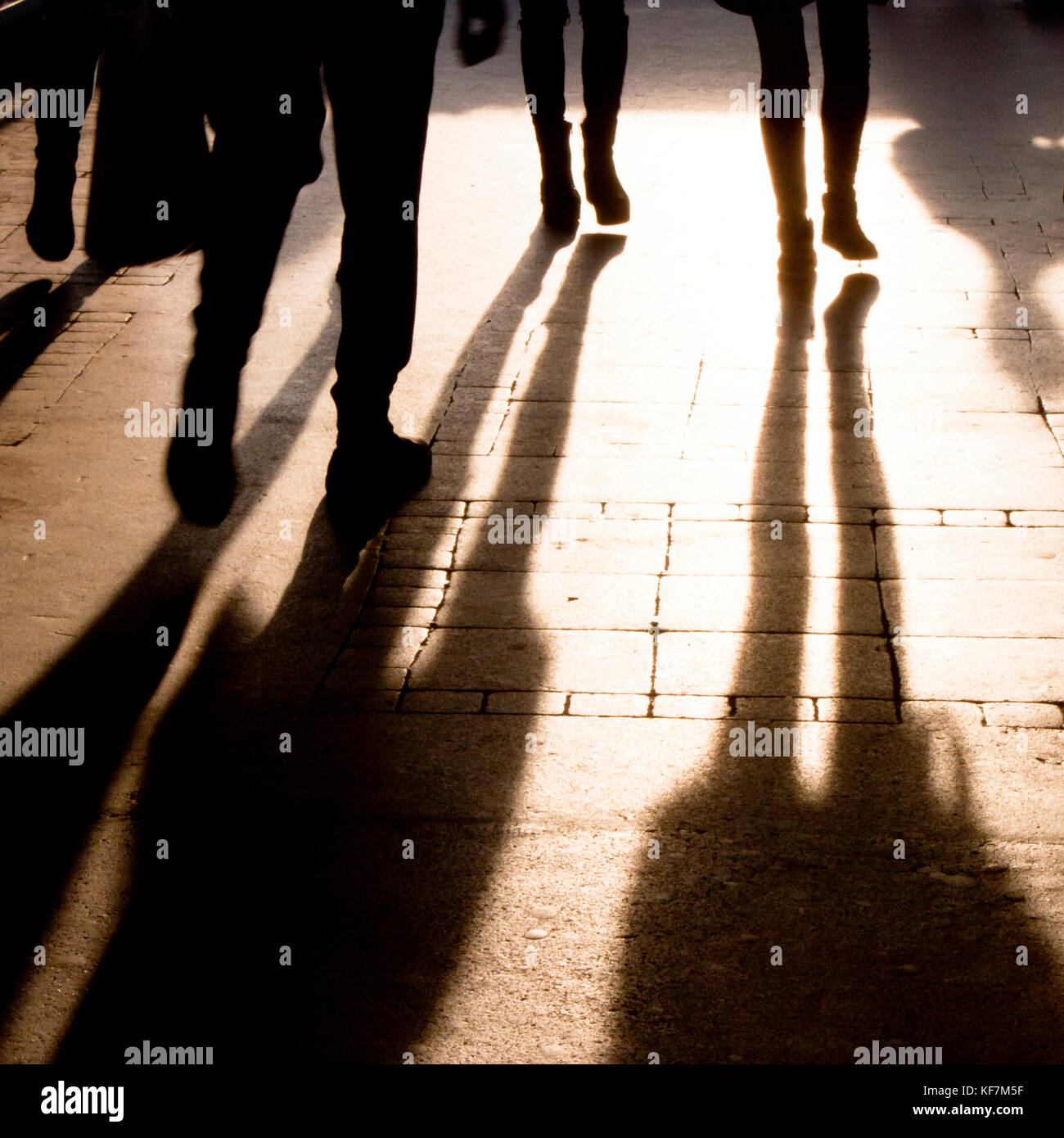 Blurry shadow and silhouette of people walking on the city street Stock  Photo - Alamy