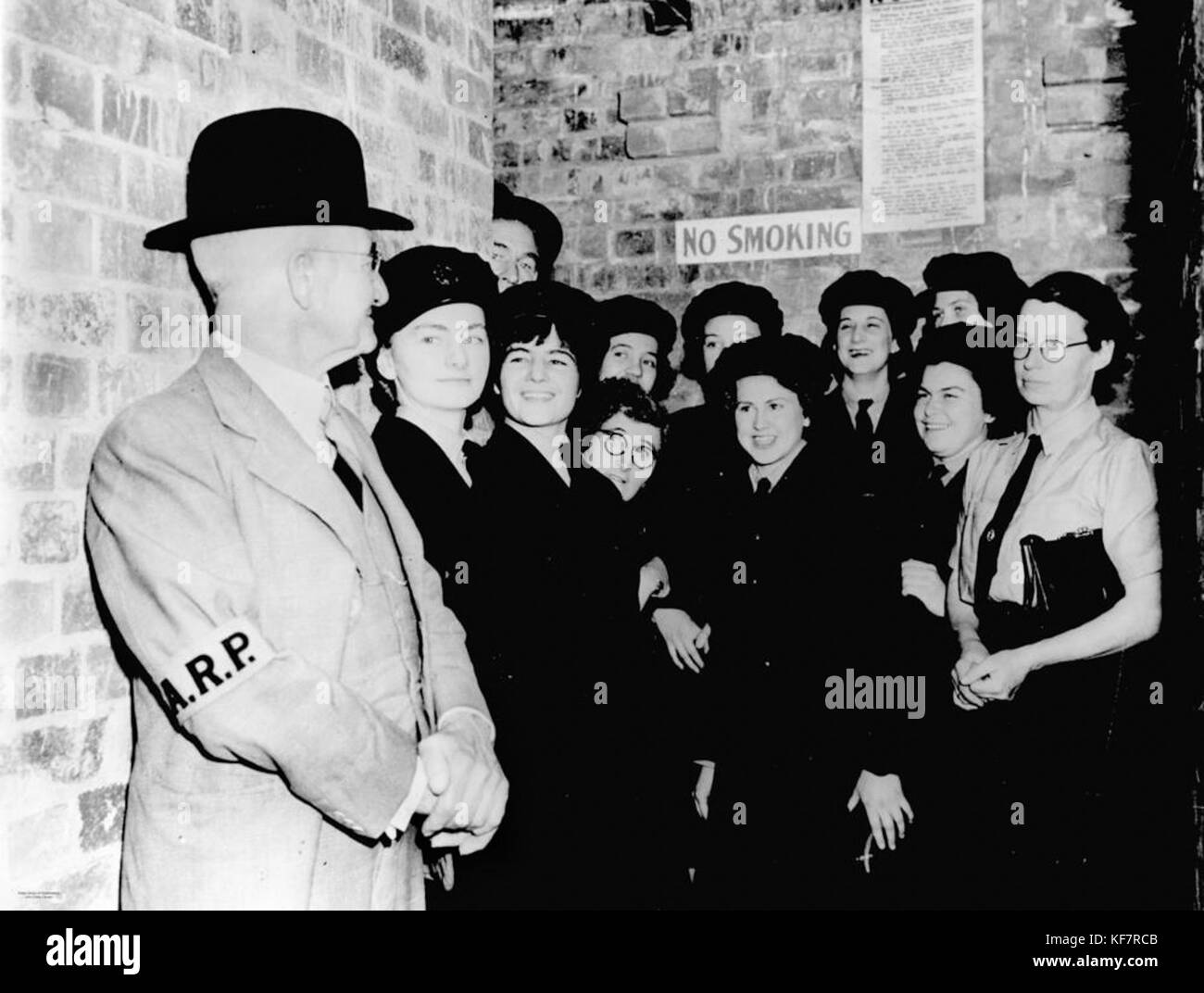 1 103742 Air raid warden and members of the W.A.A.F in a Brisbane air raid shelter, 1942 Stock Photo
