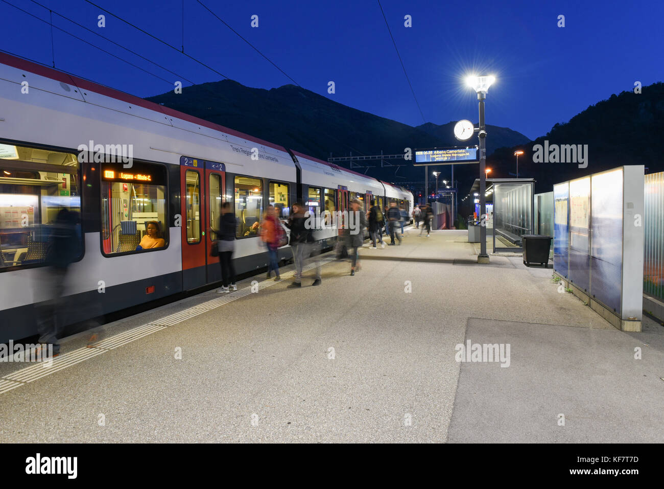 Lamone, Switzerland - 5 october 2017: Train station of Lamone with people on movement in rush hour Stock Photo