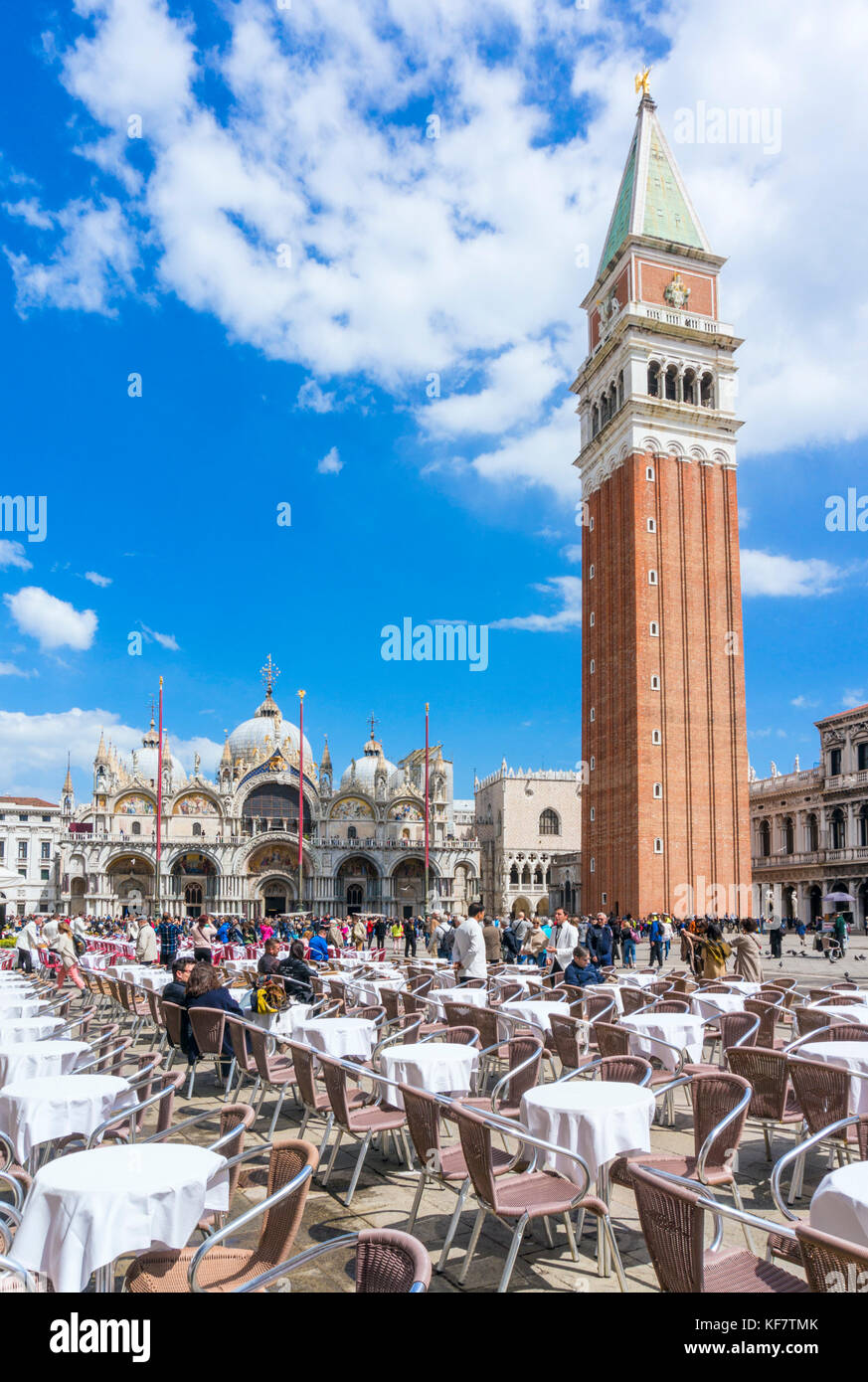 VENICE ITALY VENICE Cafes in St marks Square Piazza san marco in front of the Campanile and basilica di san marco  St. Mark’s Basilica Venice italy Stock Photo