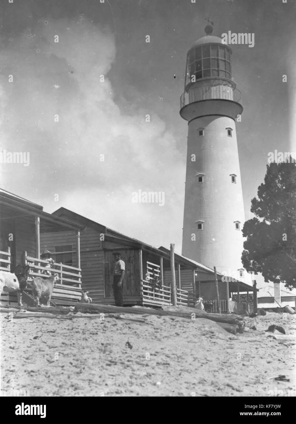 Sandy Cape lighthouse seen from the front of the lighthouse keepers' cottages, Fraser Island, 1907 Stock Photo