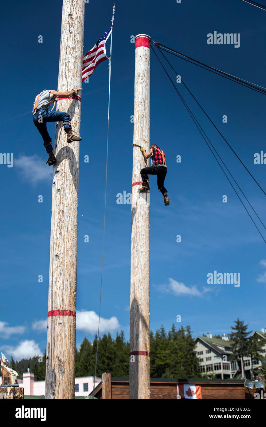 USA, Alaska, Ketchikan, two men race to the top during the Great