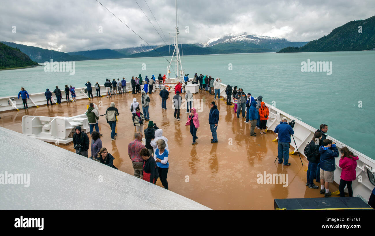 USA, Alaska, Glacier Bay, passengers withstand the weather to get a view of Johns Hopkins