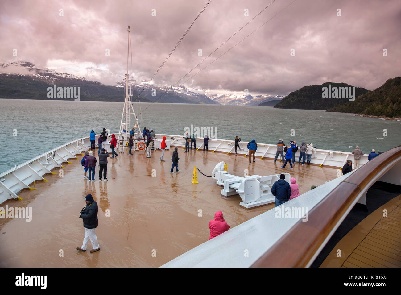 USA, Alaska, Glacier Bay, passengers withstand the weather to get a