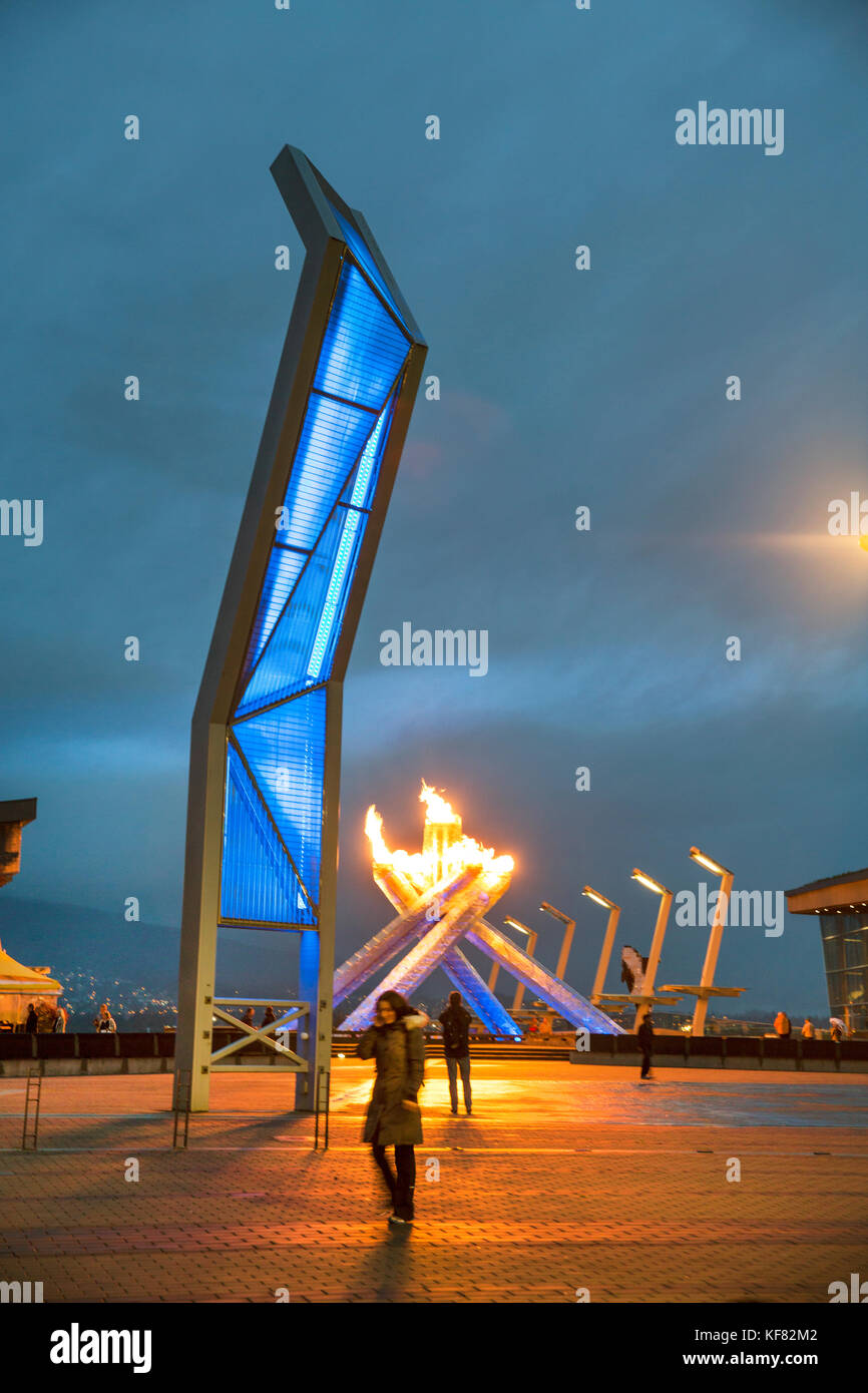 CANADA, Vancouver, British Columbia, located next to the Vancouver Convention Center the sculpture Olympic Cauldron lights up on a Summers night in Co Stock Photo