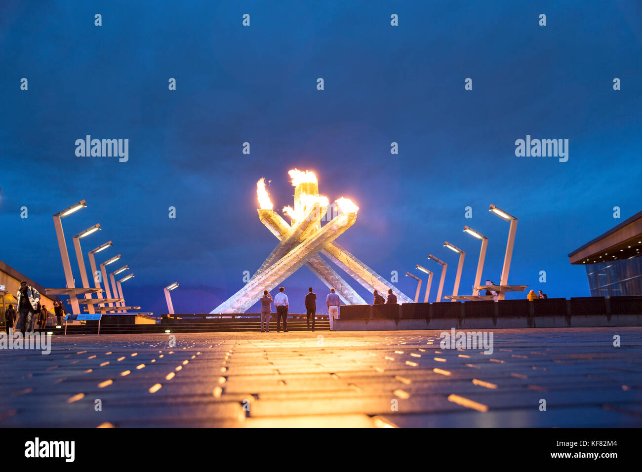 CANADA, Vancouver, British Columbia, located next to the Vancouver Convention Center the sculpture Olympic Cauldron lights up on a Summers night in Co Stock Photo
