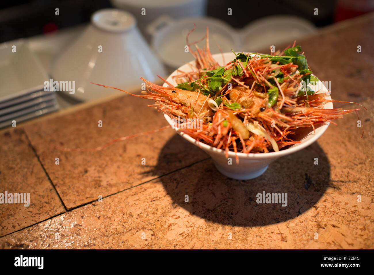 CANADA, Vancouver, British Columbia, a bowl of fried shrimp heads are served at a local bistro Edible Canada located on Granville Island Stock Photo
