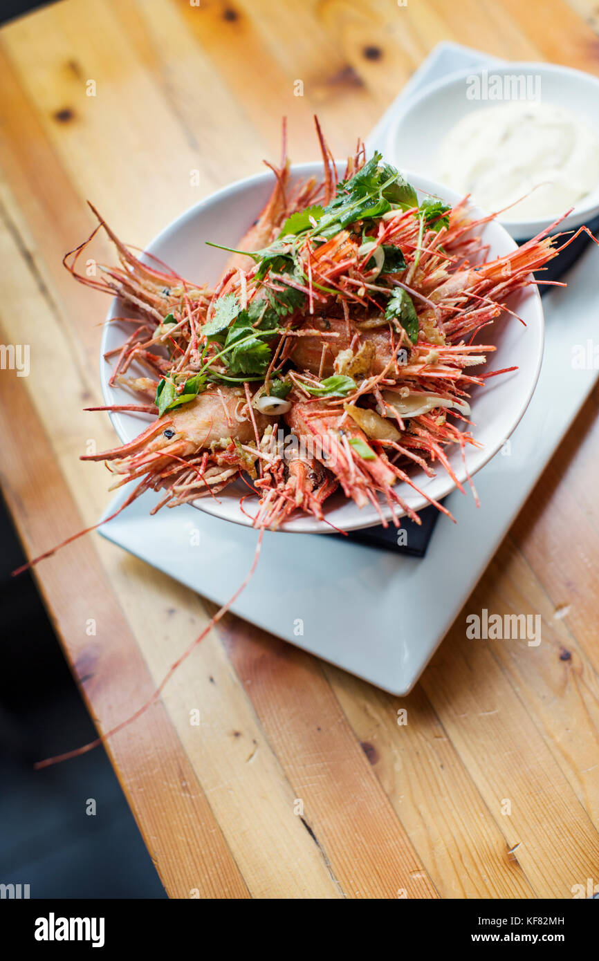 CANADA, Vancouver, British Columbia, a bowl of fried shrimp heads are served at a local bistro, Edible Canada, located on Granville Island Stock Photo