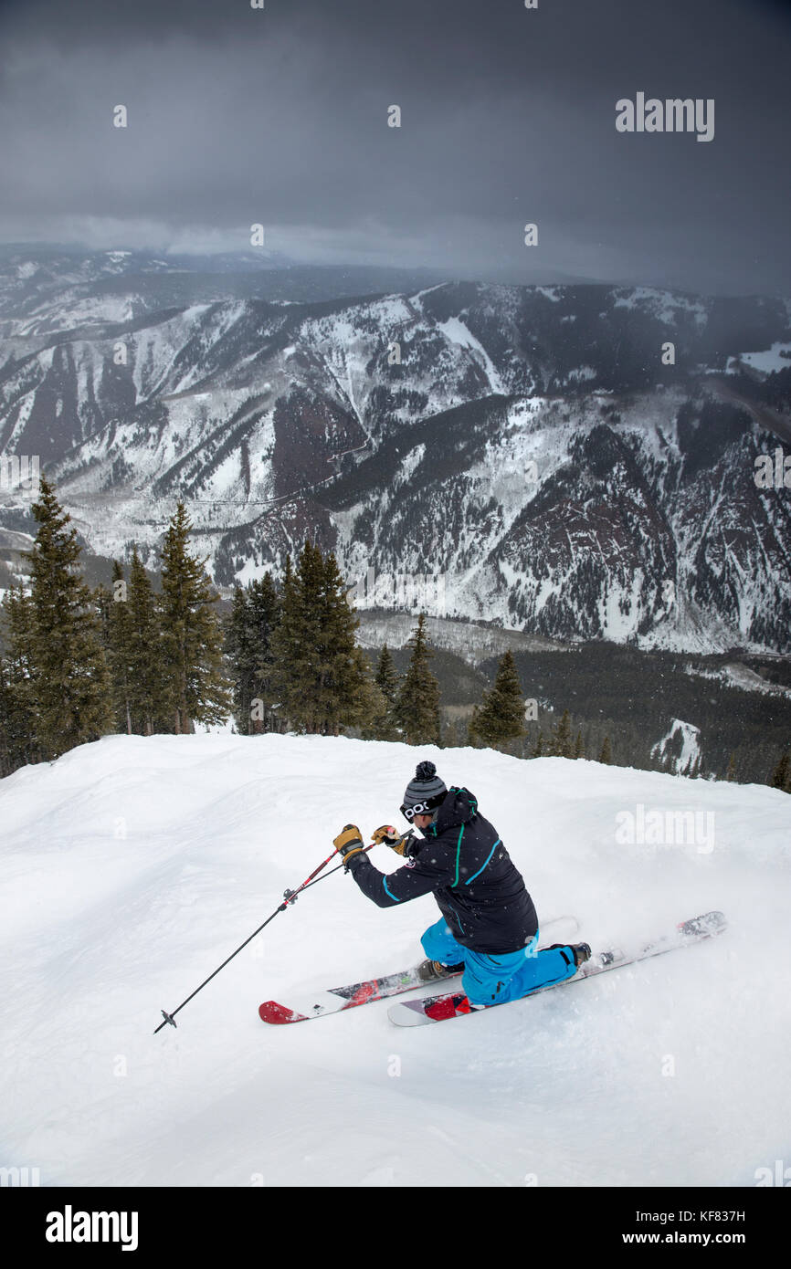 USA, Colorado, Aspen, telemark skier makes turns at the top of Kessler's run, Aspen Highlands Ski Resort Stock Photo