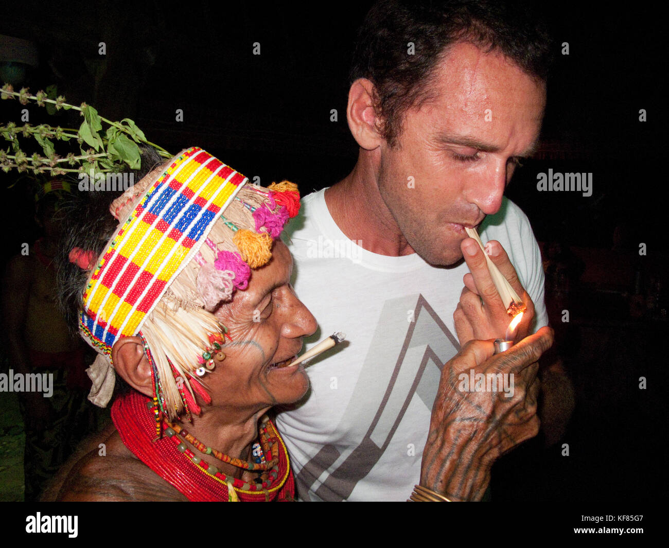 Lighting two cigarettes hi-res stock photography and images