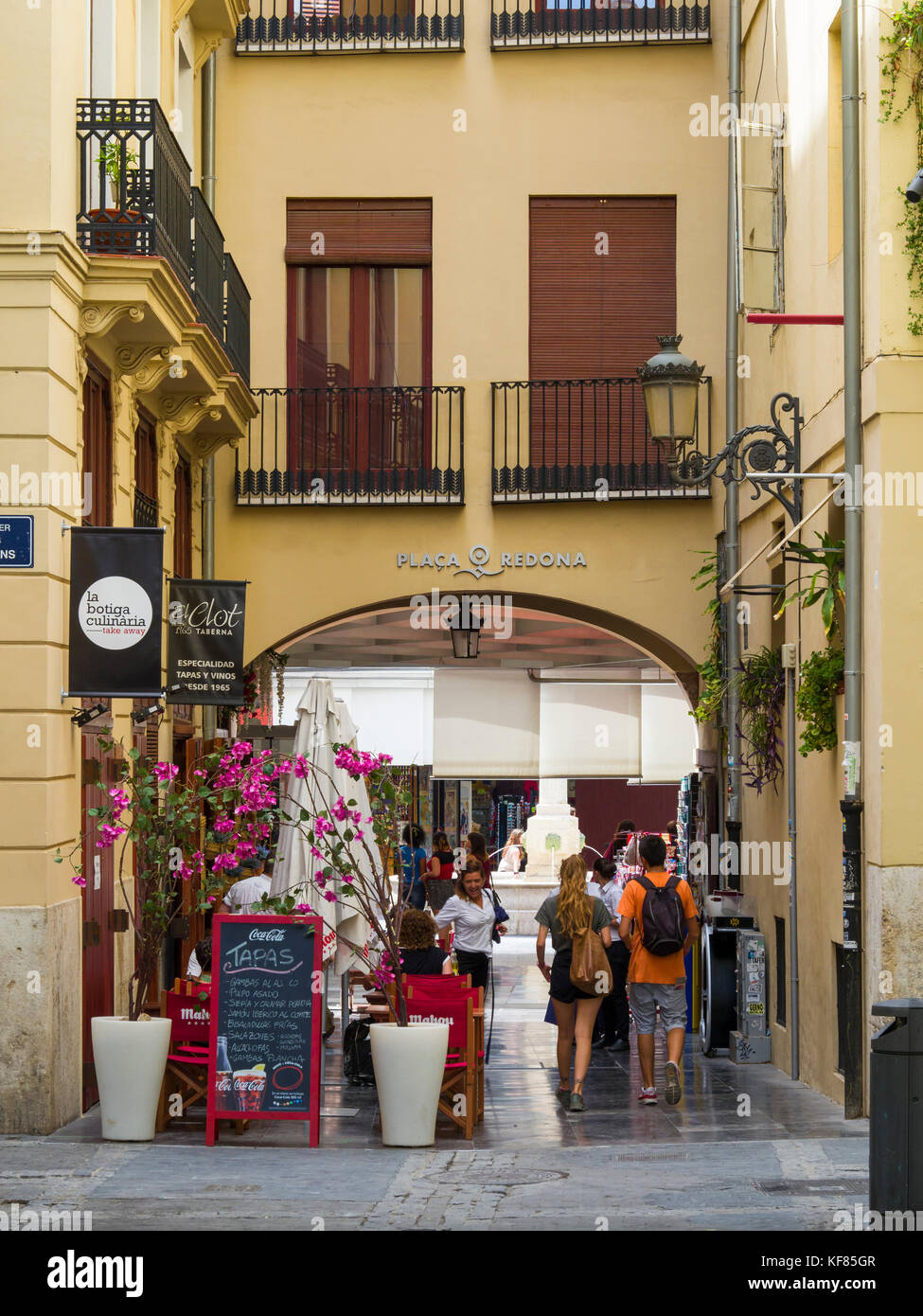 One of the entrances to Plaça Redona, a circular  pedestrianised area  containing boutique stalls, shops and tapas bars, Valencia, Spain Stock Photo