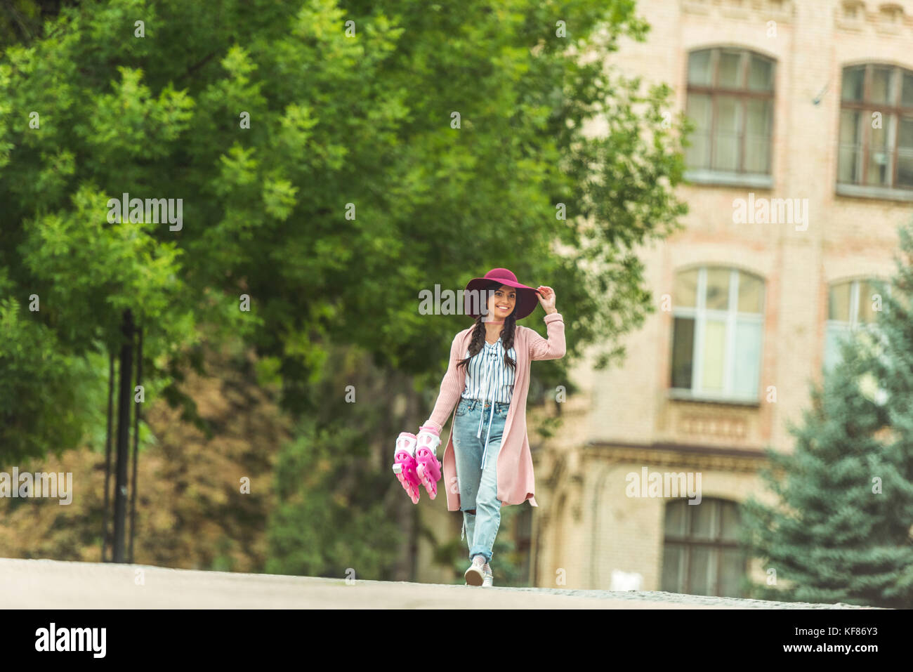 happy girl with roller skates Stock Photo Alamy