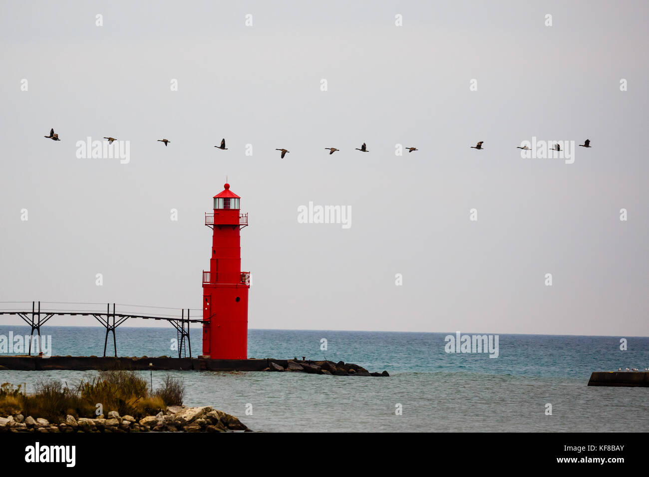 October Lighthouse Geese flying by the Algoma lighthouse in October Stock Photo - Alamy