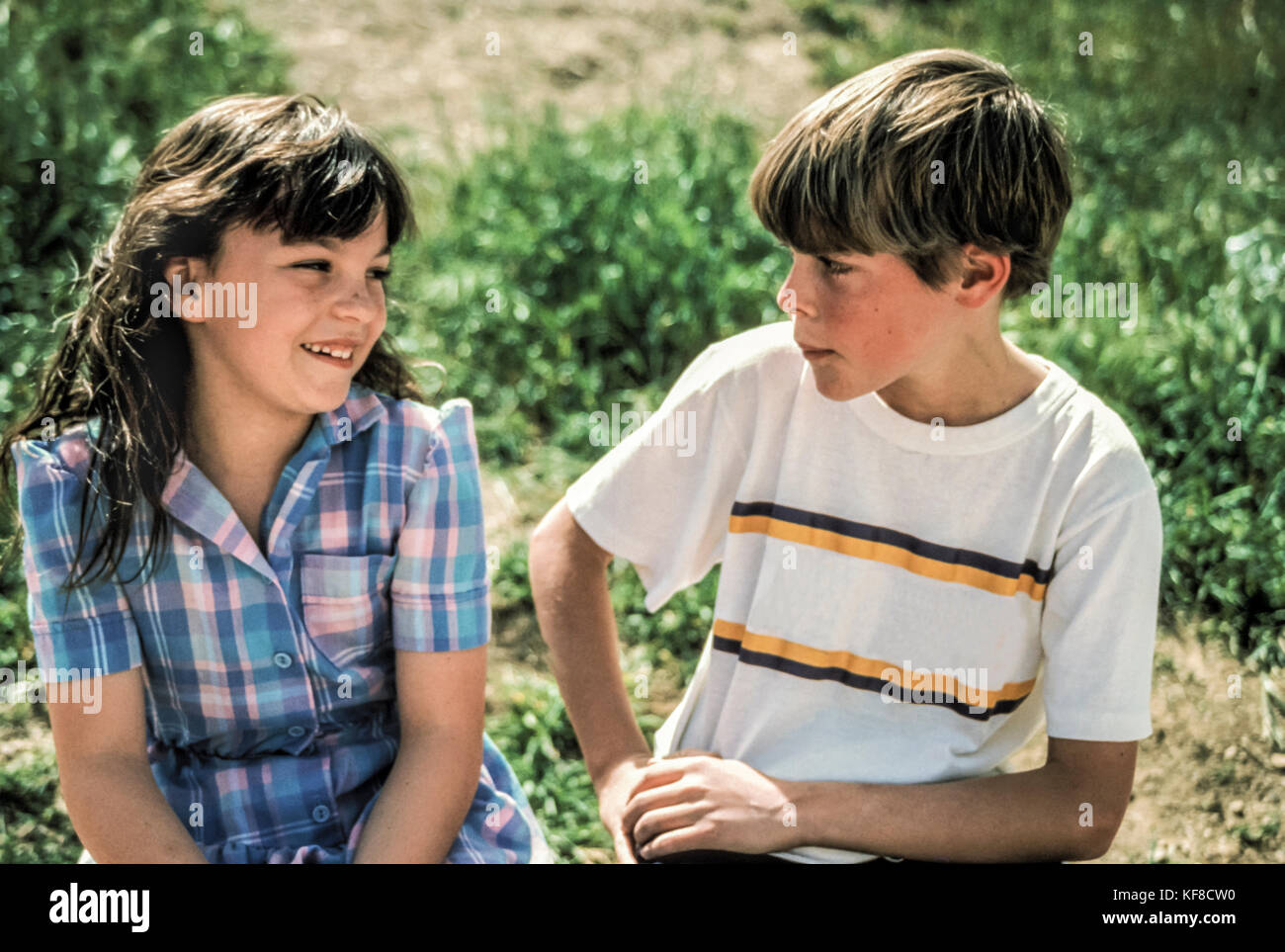 Children Two kids girl boy relaxed conversation talking talk outside side view profile 8-9 year olds 10-11 years old MR  © Myrleen Pearson.  ...Ferguson Cate Stock Photo