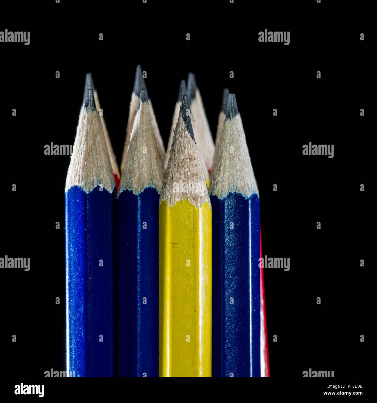 A macro shot of a group of pencils shot against a black background. Stock Photo
