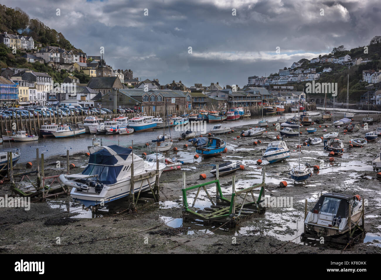 The picturesque harbour at low tide, in the working fishing port of Looe, Cornwall in October. Stock Photo
