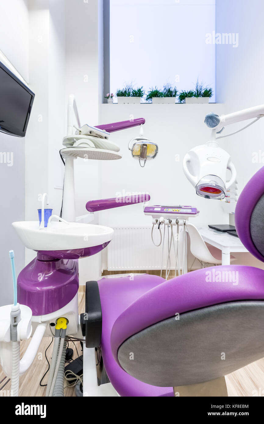 Purple dental chair with top quality professional tools Stock Photo