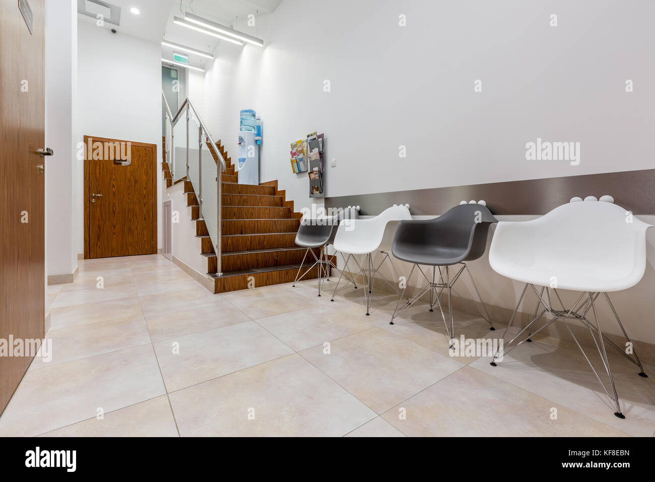 Waiting area in hallway with stairs in dental clinic Stock Photo