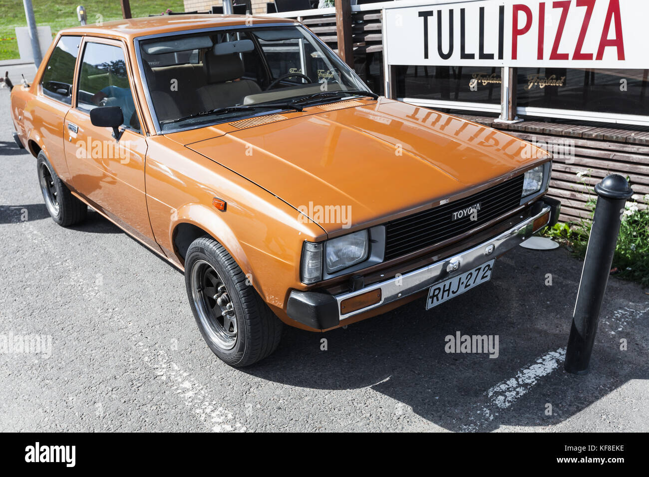 Lappeenranta, Finland - July 1, 2017: Orange brown Toyota Corolla stands on a parking lot. Type E70, fourth generation produced in 1979–1983 by Toyota Stock Photo