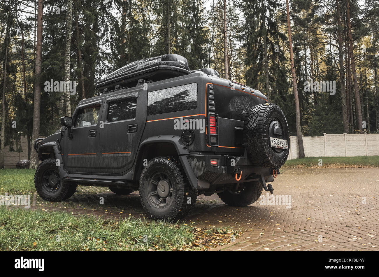 Saint-Petersburg, Russia - October 8, 2017: Black Hummer H2 car stands on rural parking in Russian countryside, front view Stock Photo