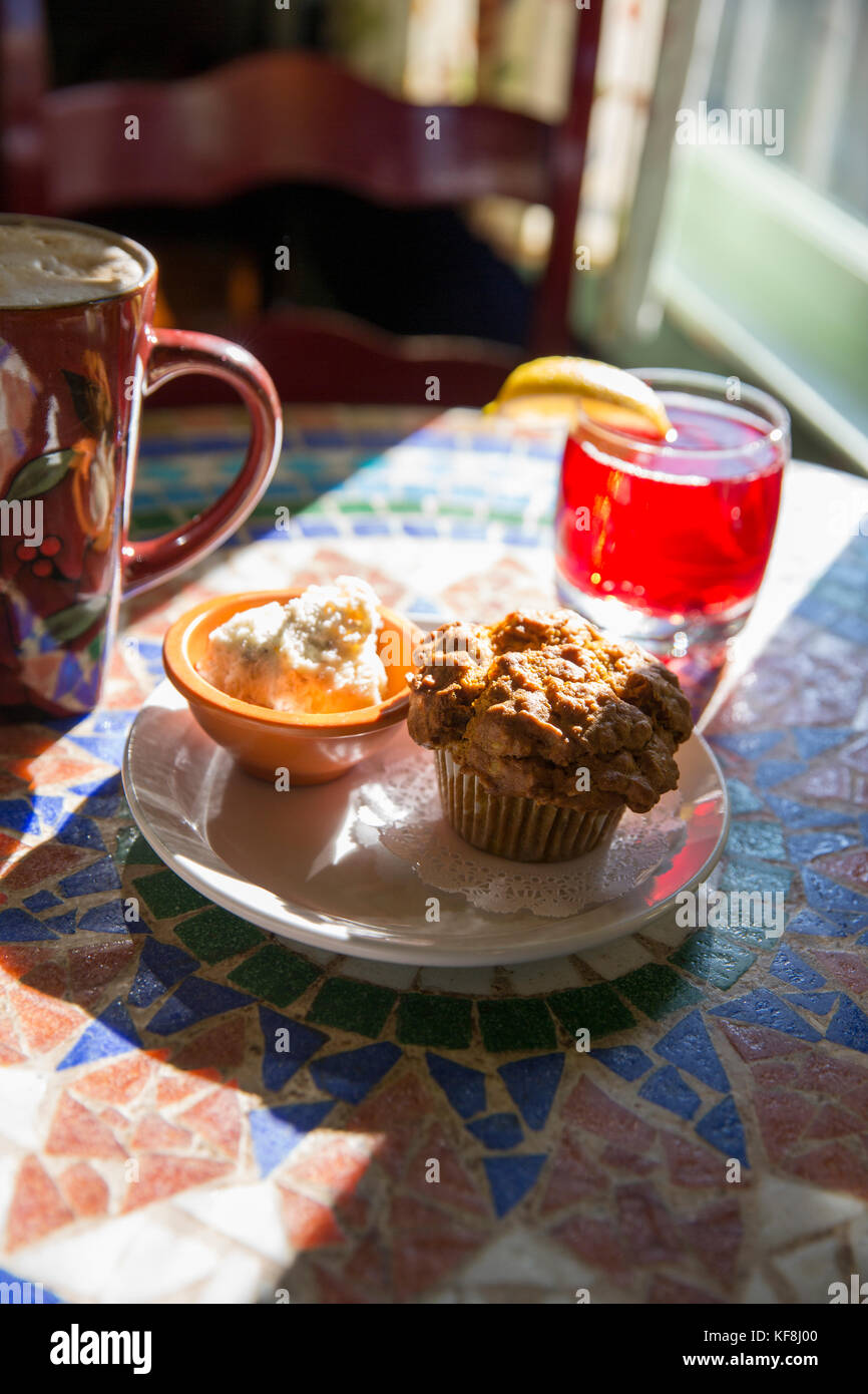 USA, Oregon, Ashland, interior table detail at the colorful Morning Glory Restaurant on Siskiyoui Blvd during breakfast, pumpkin oat muffin served wit Stock Photo