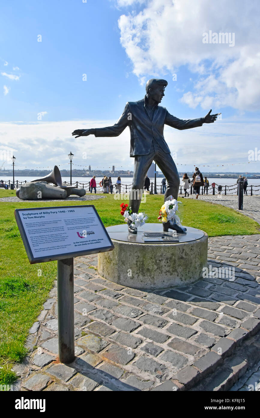 Liverpool waterfront sculpture of Billy Fury by Tom Murphy and information panel provided by Museum of Liverpool River Mersey & Birkenhead beyond UK Stock Photo