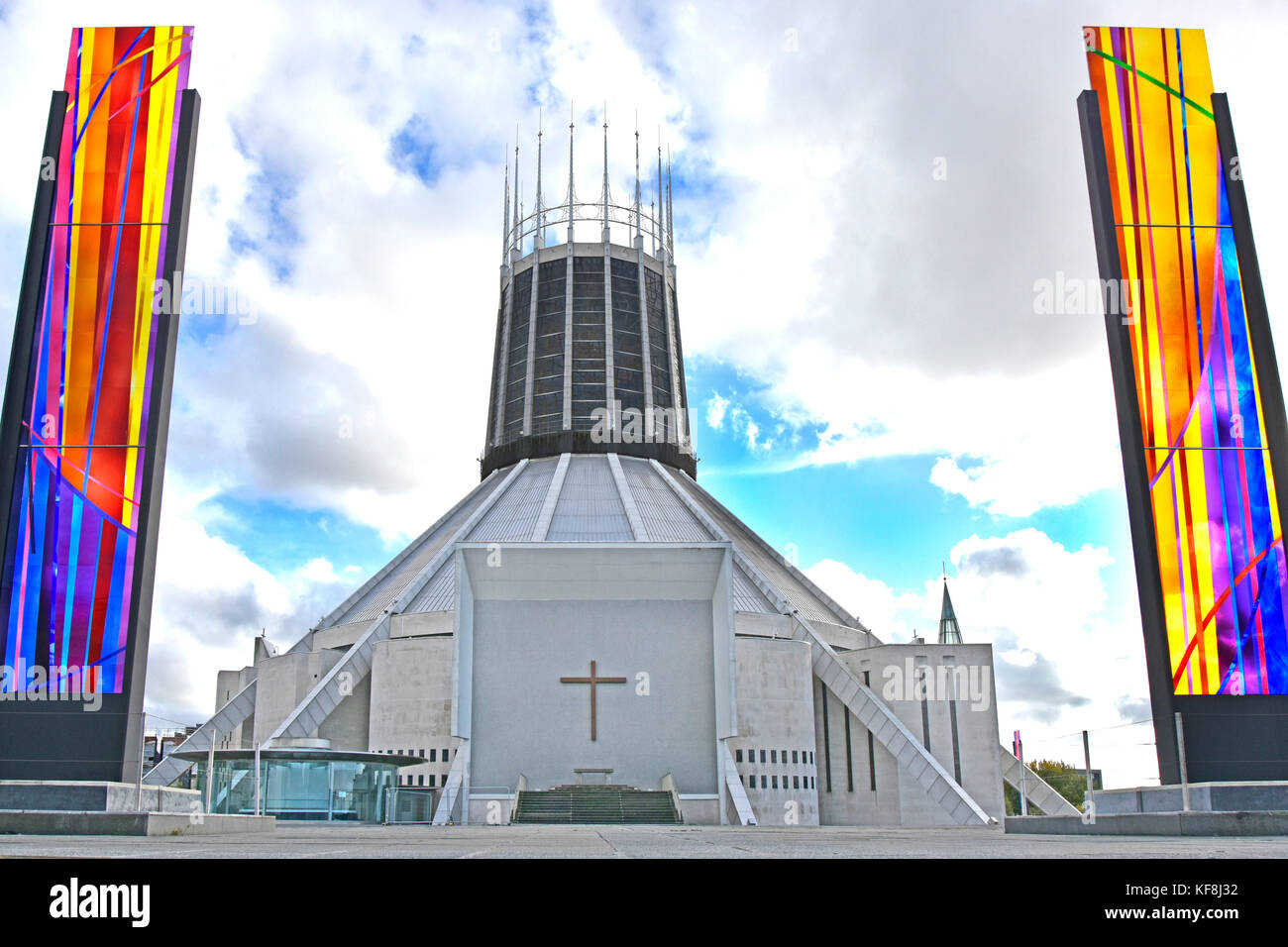 Liverpool Metropolitan Cathedral modern architecture & design of the Catholic church exterior flanked by stained glass panels Merseyside England UK Stock Photo