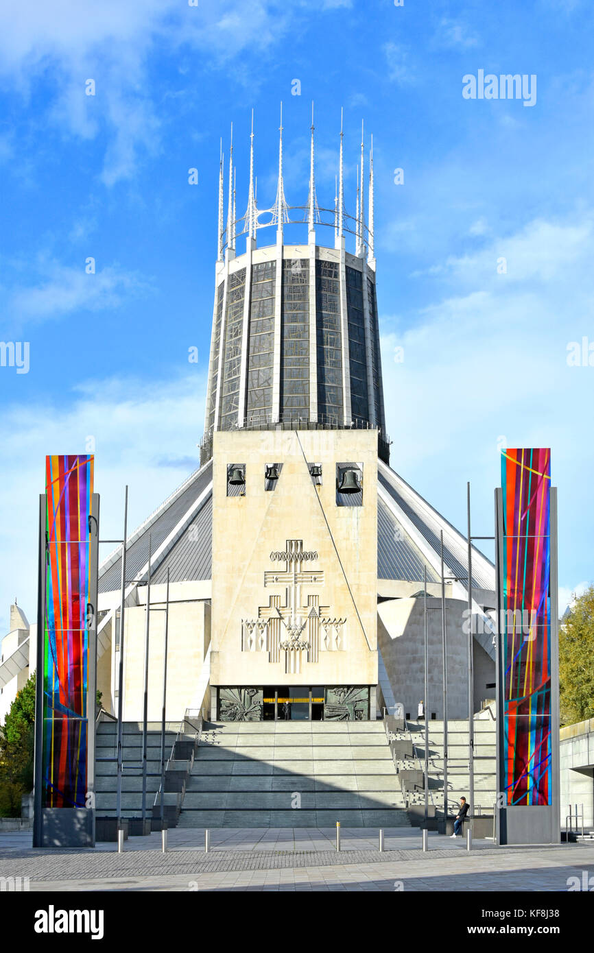 Modern architecture & design of the Catholic Liverpool Metropolitan Cathedral church exterior flanked by stained glass panels Merseyside England UK Stock Photo