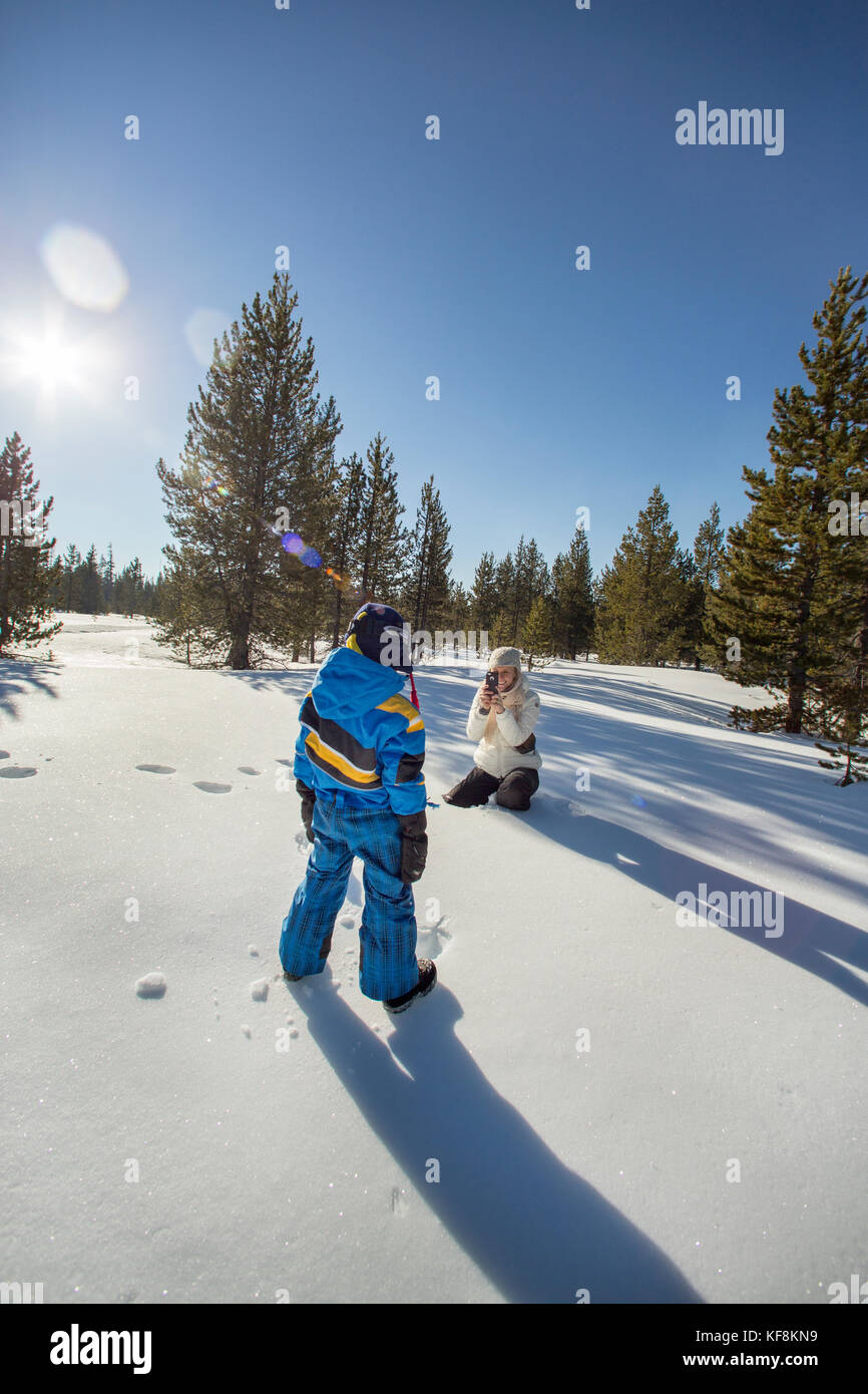 USA, Oregon, Bend, a young boy getting his picture taken while out