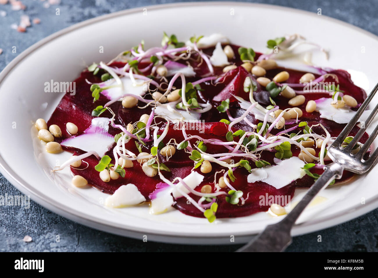Vegetarian beetroot carpaccio salads with olive oil, goat cheese, pine