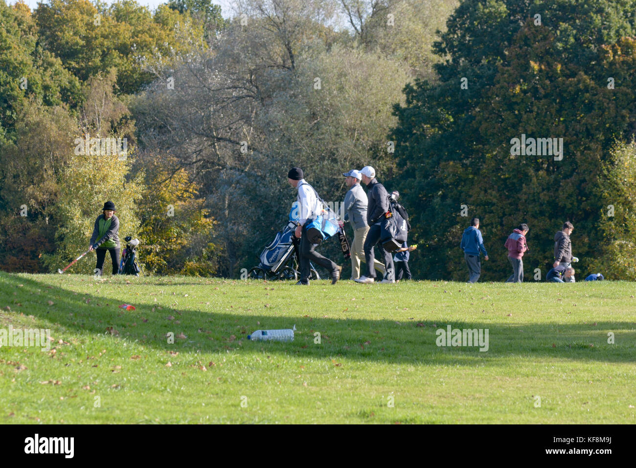 Golfers on a busy gold course in Reigate, Surrey, England Stock Photo