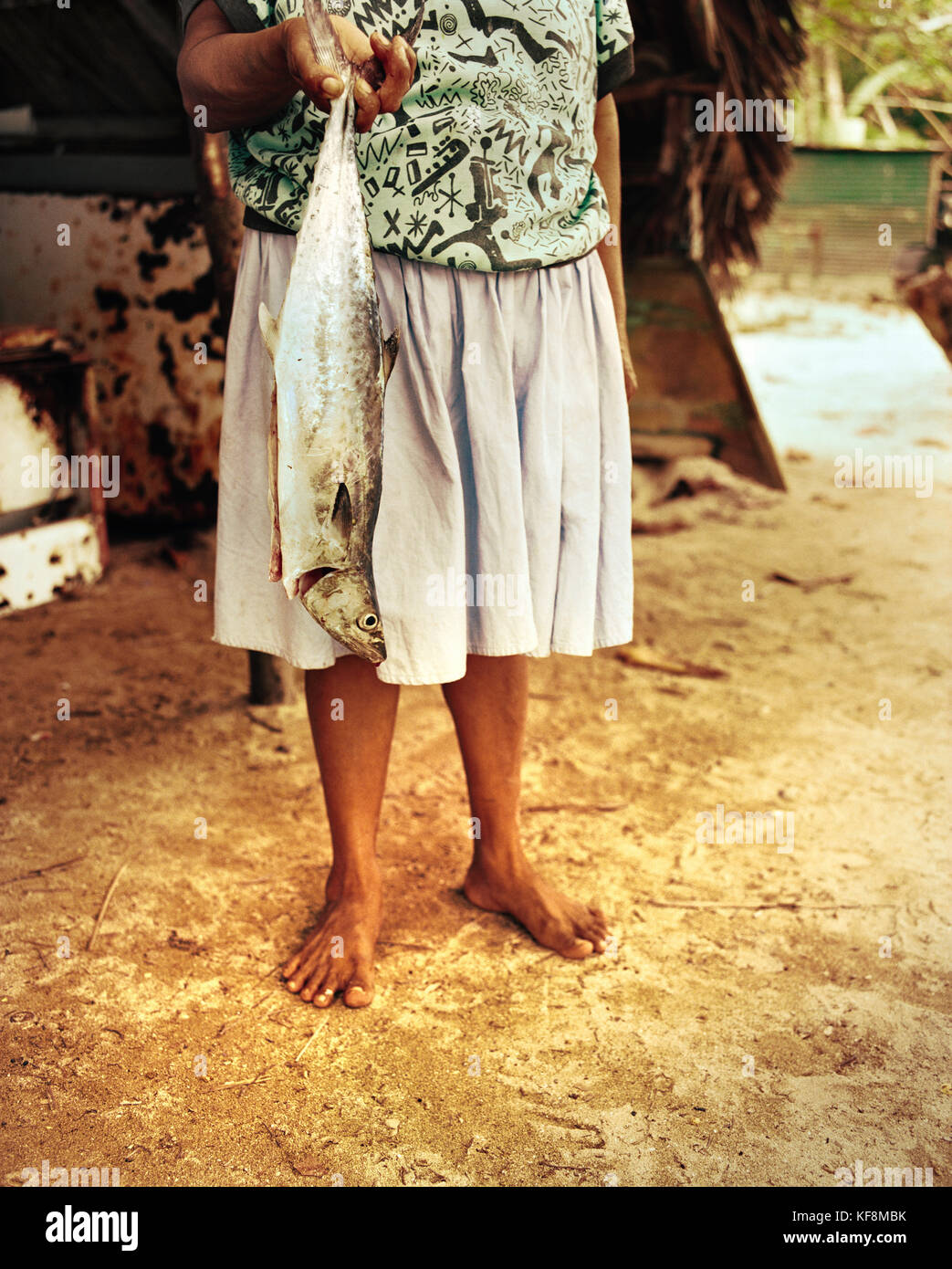 PANAMA, Isla Bastimentos, a woman gets ready to prepare a fish dinner, Central America Stock Photo