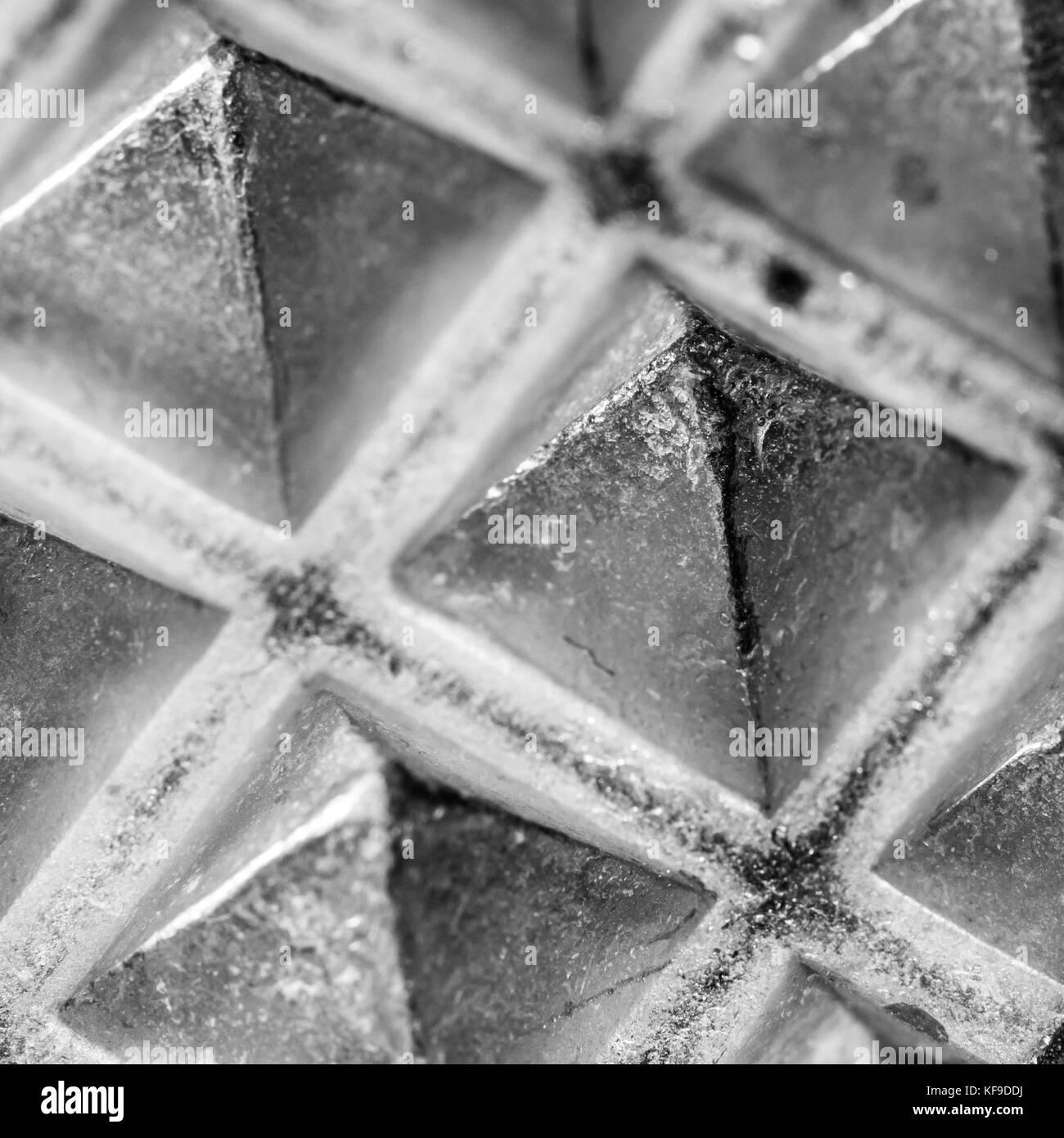 A close-up of the metallic surface of a meat tenderiser. Stock Photo