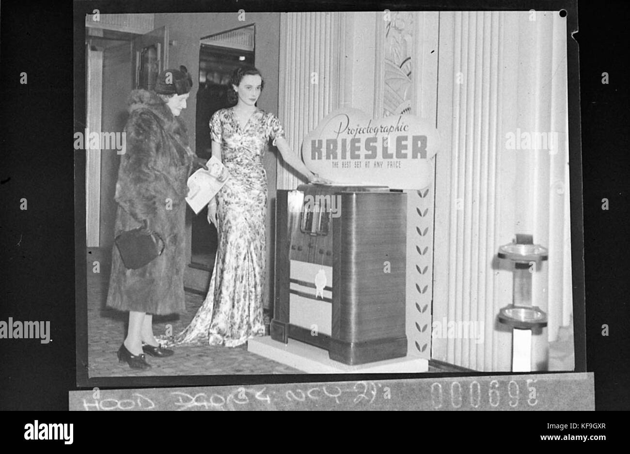 11656 Kriesler radio display at Embassy Theatre for Radio Retailer Usherette demonstrates Projectographic Kriesler radio Stock Photo