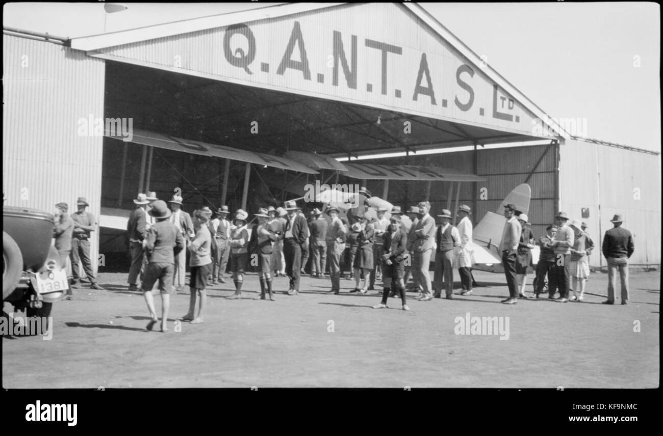 Les Holden's de Havilland DH61 Giant Moth biplane airliner G AUHW 'Canberra' in a Qantas hangar is examined by crowd, Longreach, Queensland, 25 April 1929. (7974549837) Stock Photo